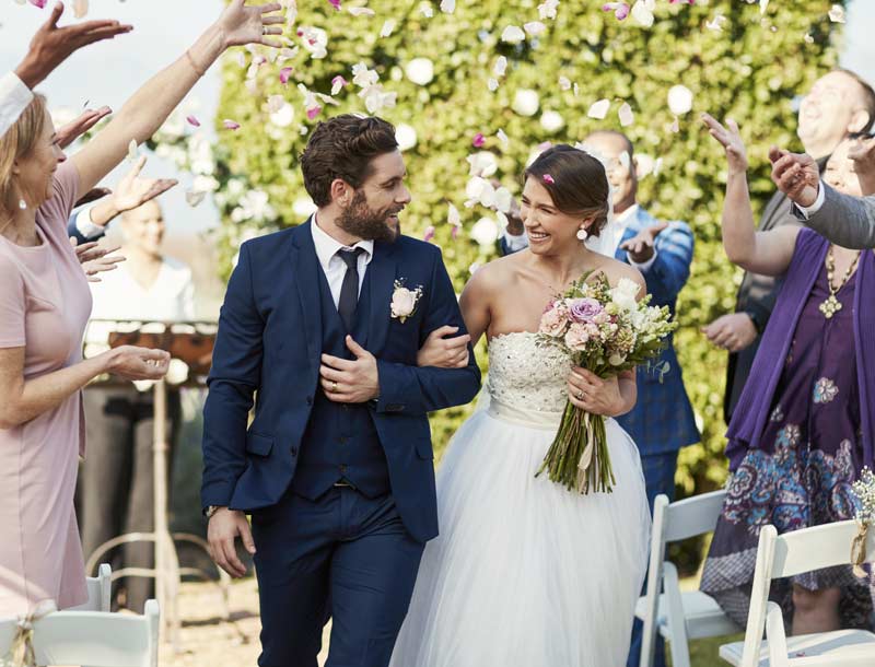 Bride and groom smiling at wedding